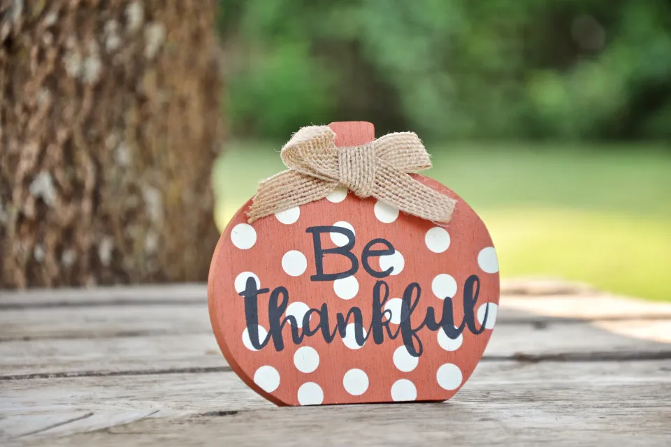 autumn pumpkin with a reminder to be grateful